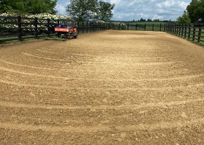 Outdoor horse arena featuring ThorTurf synthetic dustless footing horse surface