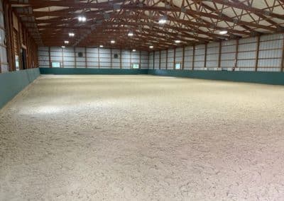 ThorTurf arena horse footing in an indoor barn